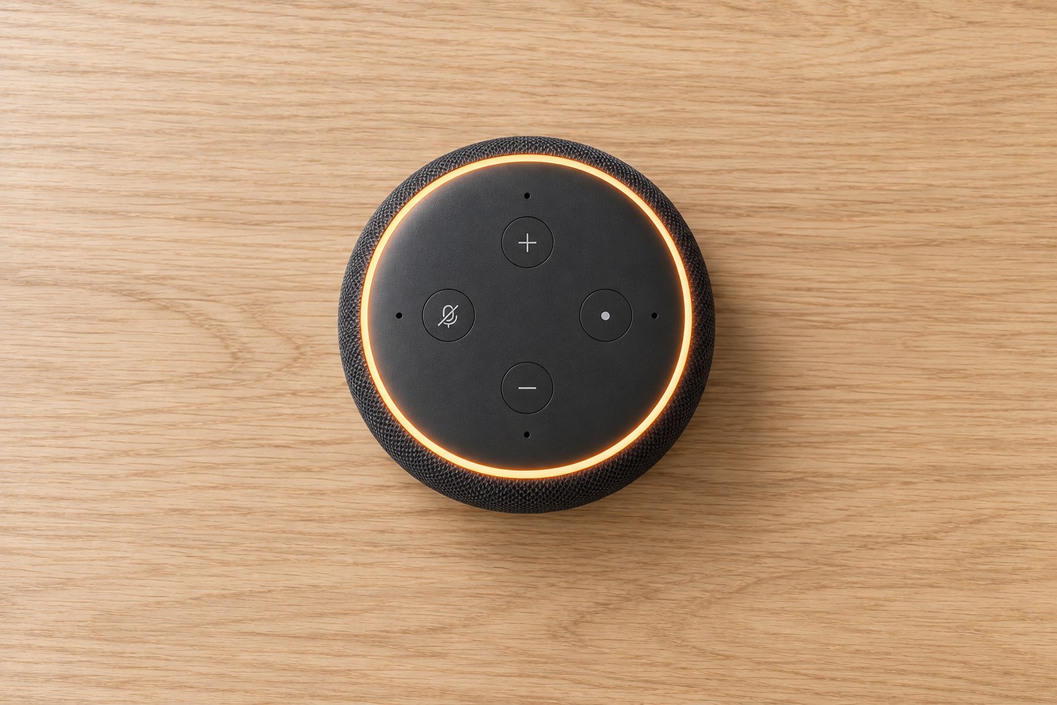 The Omnivox device on the same desk, in the same spot the keyboard was, its orange ring lit